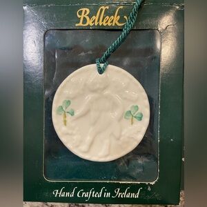 Belleek 11 Lords A Leaping Christmas ornament made with fine Parisian China
